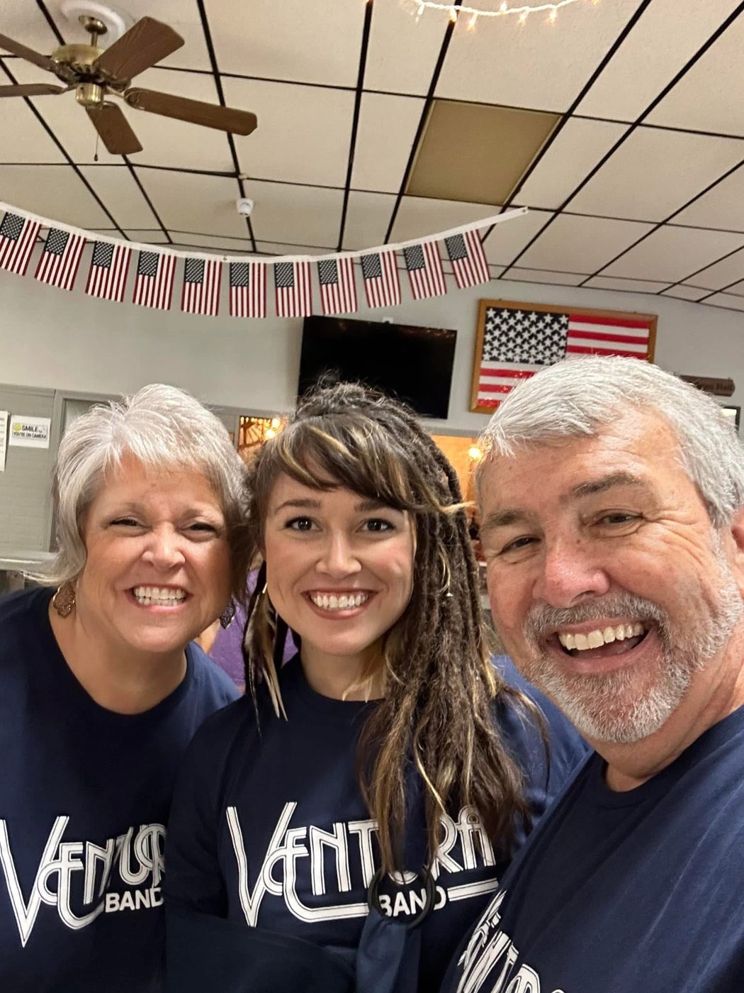 Mark and Tina Anderson with their daughter, all in Ventura Band shirts