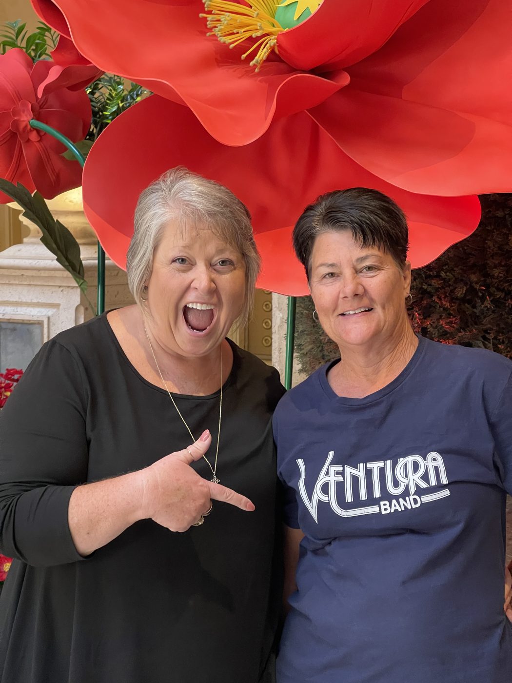 Two friends, one wearing a Ventura Band shirt