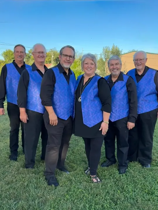 The six members of The Ventura Band in matching blue paisley vests